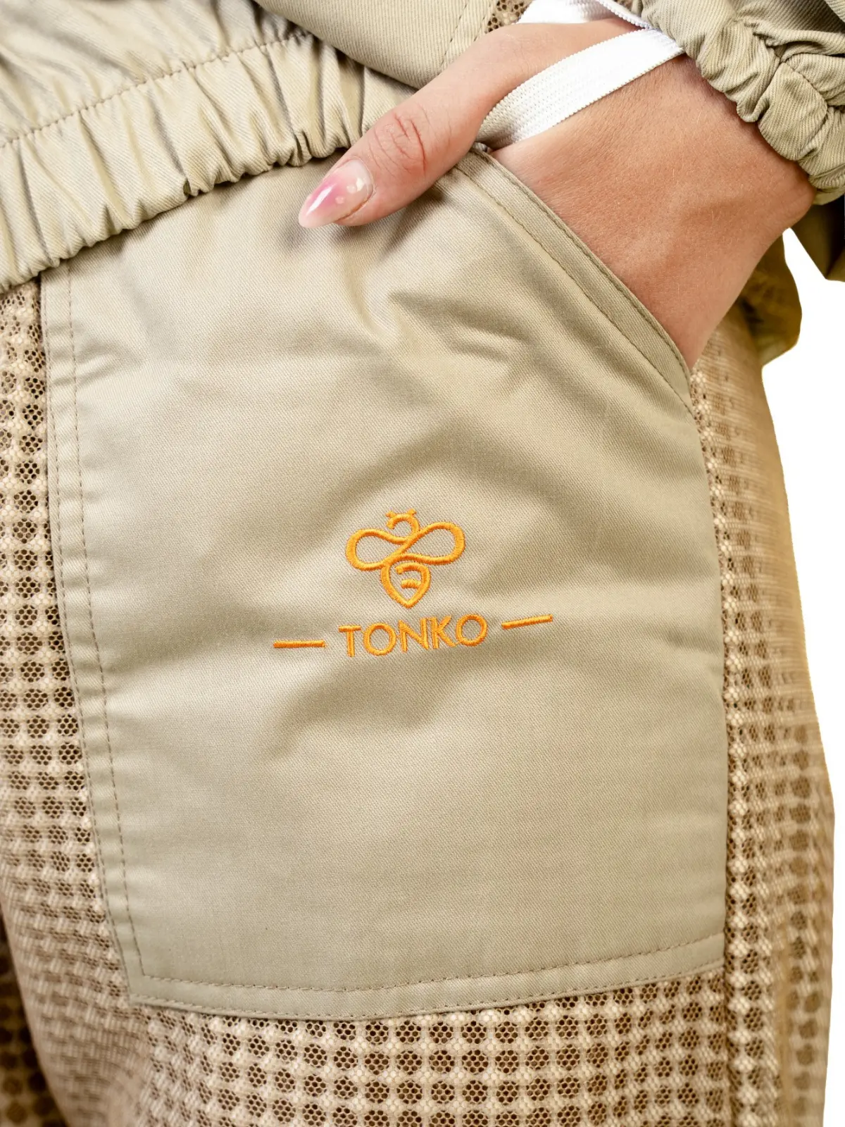 Embroidered Tonko logo on the pocket of a beekeeping suit